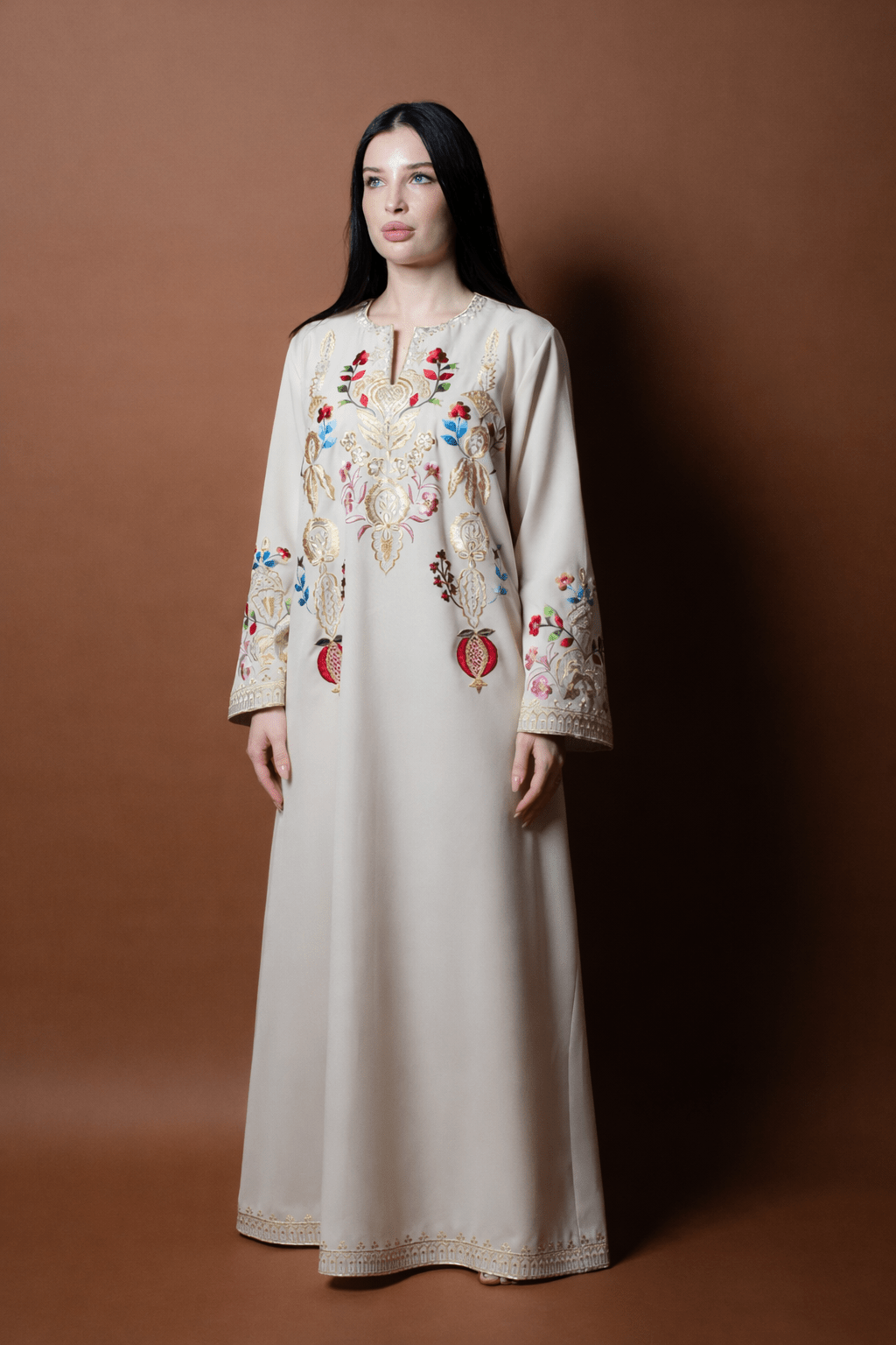 QITAF KAFTAN - CATERPILLAR - MIRA Y MANO
