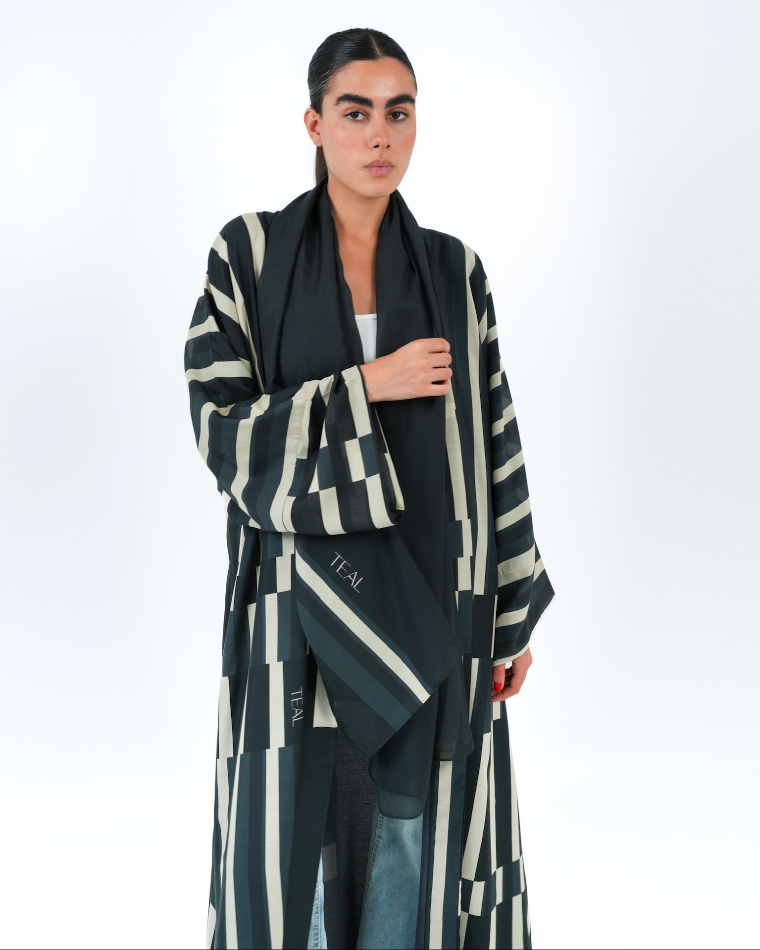STRATA-BK ABAYA - TEAL - MIRA Y MANO