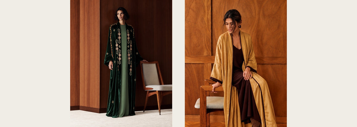 Two autumn looks in wood-panelled rooms: a dark green velvet abaya with gold geometric embroidery over a green dress, and a goldenrod washed-silk abaya over a dark brown dress