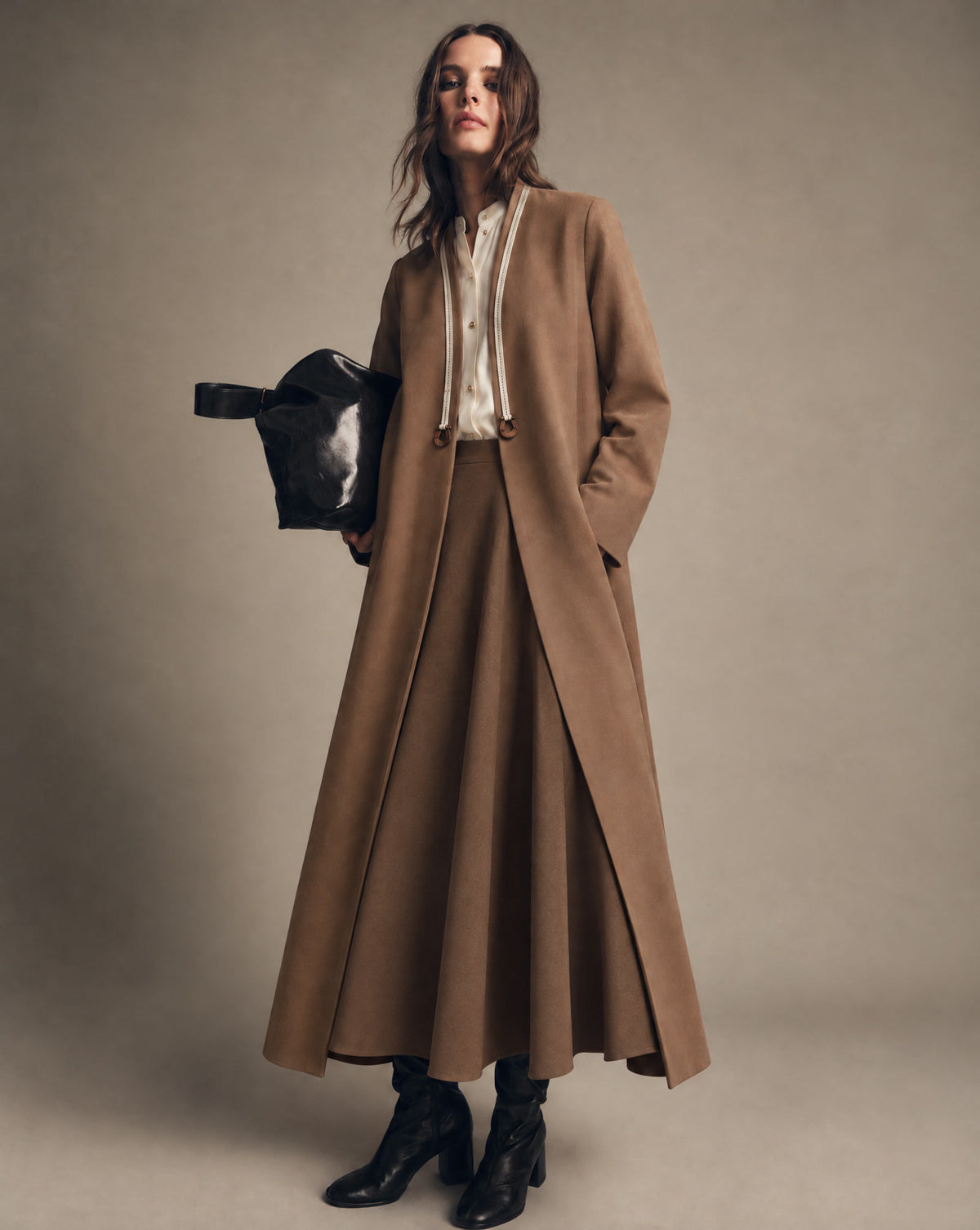 Long coats for fall: a camel long coat over a brown skirt (desktop); a navy jacquard long coat over ivory wide trousers (phones)