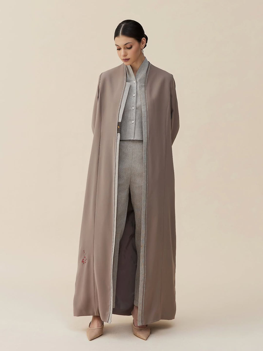 Taupe open abaya over a grey tailored waistcoat and trousers