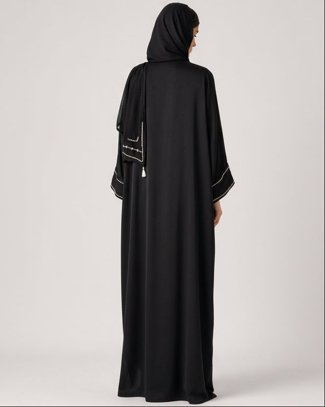 SUM1004 ABAYA - NORA AL SHAIKH - MIRA Y MANO