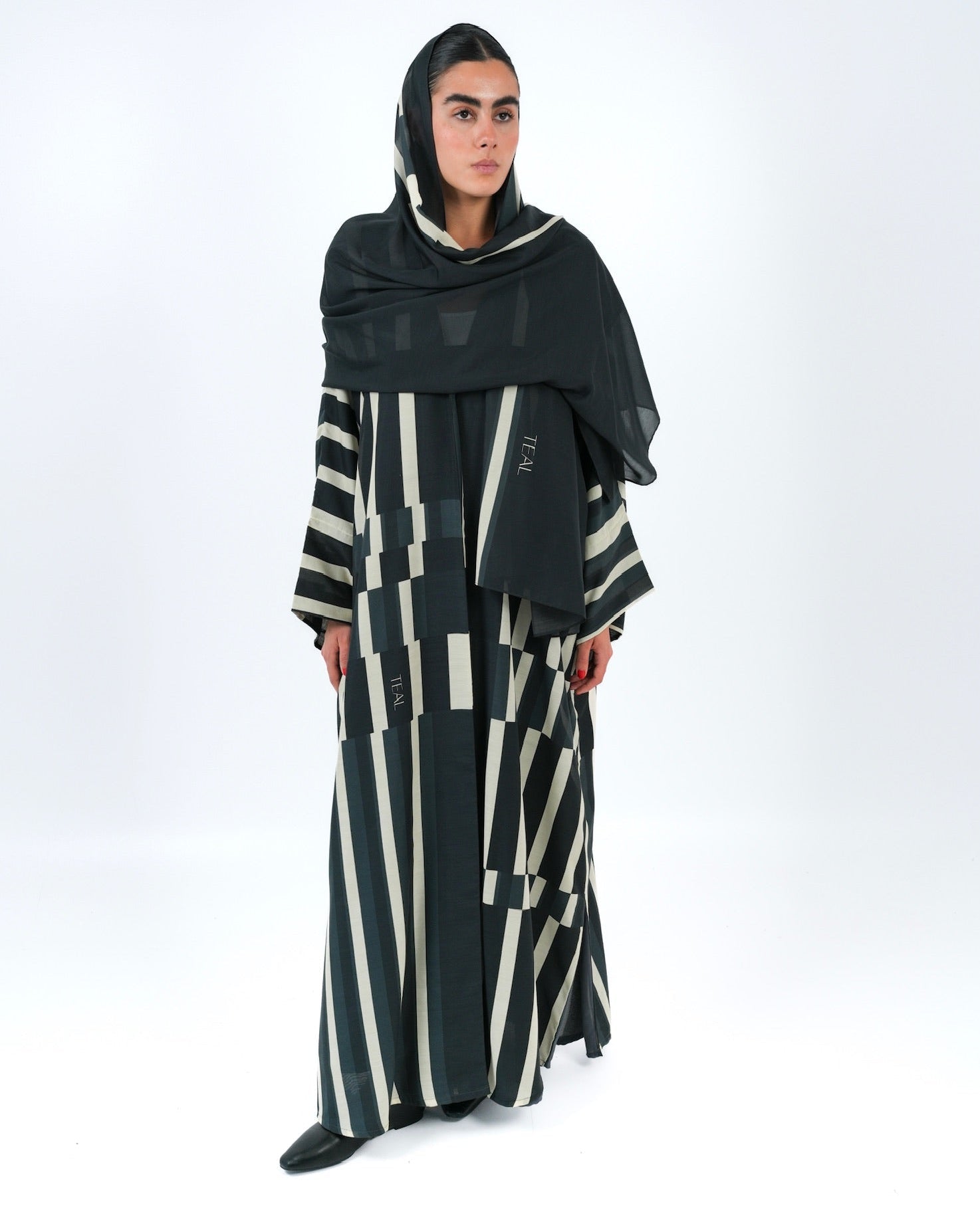 STRATA-BK ABAYA - TEAL - MIRA Y MANO
