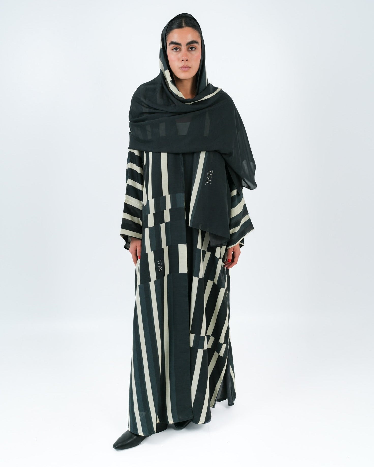 STRATA-BK ABAYA - TEAL - MIRA Y MANO