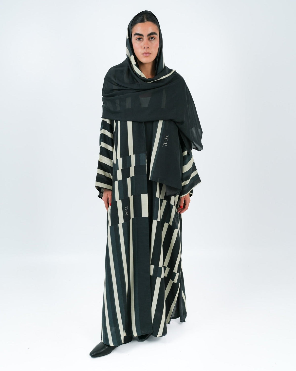 STRATA-BK ABAYA - TEAL - MIRA Y MANO